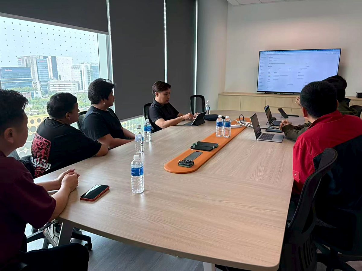 S Triformix engineering team in a design review meeting with power modules on the table